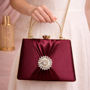 Elegant Maroon Satin Clutch with Crystal Embellished Brooch & Gold Handle